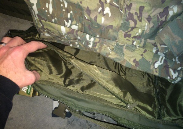 Here the sniper chose to use the second largest pocket to store his Multicam coveralls. Note the zippered pouch inside the larger open pocket.