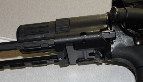 The underside of the M7A1 housing, providing another view of the locking bar and release lever.