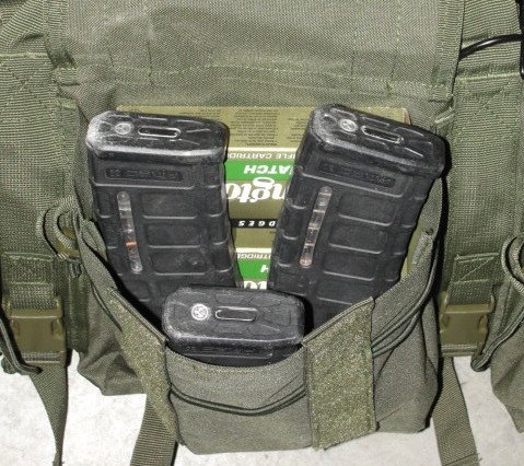 The larger middle pocket can store a lot of loose items. Here (3) Pmags, (2) boxes of AR ammunition, (2) boxes of less lethal shotgun rounds, and several packages of foam ear pro are stored.