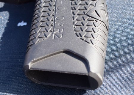 The magazine cut-outs at the bottom of the grip are intended to improve loading and magazine stripping.