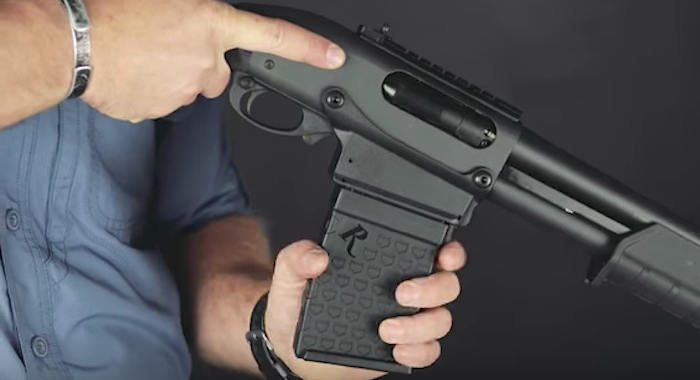 Inserting a magazine into the Remington 870 DM